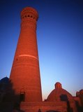 The Kalyan minaret or Minâra-i Kalân (Pesian/Tajik for the 'Grand Minaret') is part of the Po-i-Kalyan mosque complex and was designed by Bako and built by the Qarakhanid ruler Arslan Khan in 1127.<br/><br/>

The minaret is made in the form of a circular-pillar brick tower, narrowing upwards, with a diameter of 9m (30ft) at the bottom, 6m (20ft) at the top and a height of 46m (150ft) high.<br/><br/>

The Kalyan Minaret is also known as the 'Tower of Death', as for centuries criminals were executed by being tossed off the top.<br/><br/>

Bukhara was founded in 500 BCE in the area now called the Ark. However, the Bukhara oasis had been inhabitated long before.<br/><br/>

The city has been one of the main centres of Persian civilization from its early days in 6th century BCE. From the 6th century CE, Turkic speakers gradually moved in.<br/><br/>

Bukhara's architecture and archaeological sites form one of the pillars of Central Asian history and art. The region of Bukhara was for a long period a part of the Persian Empire. The origin of its inhabitants goes back to the period of Aryan immigration into the region.